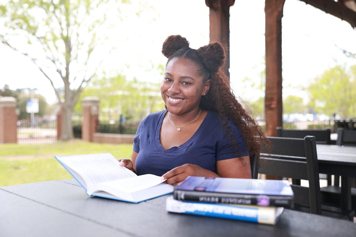 JSU student reading books